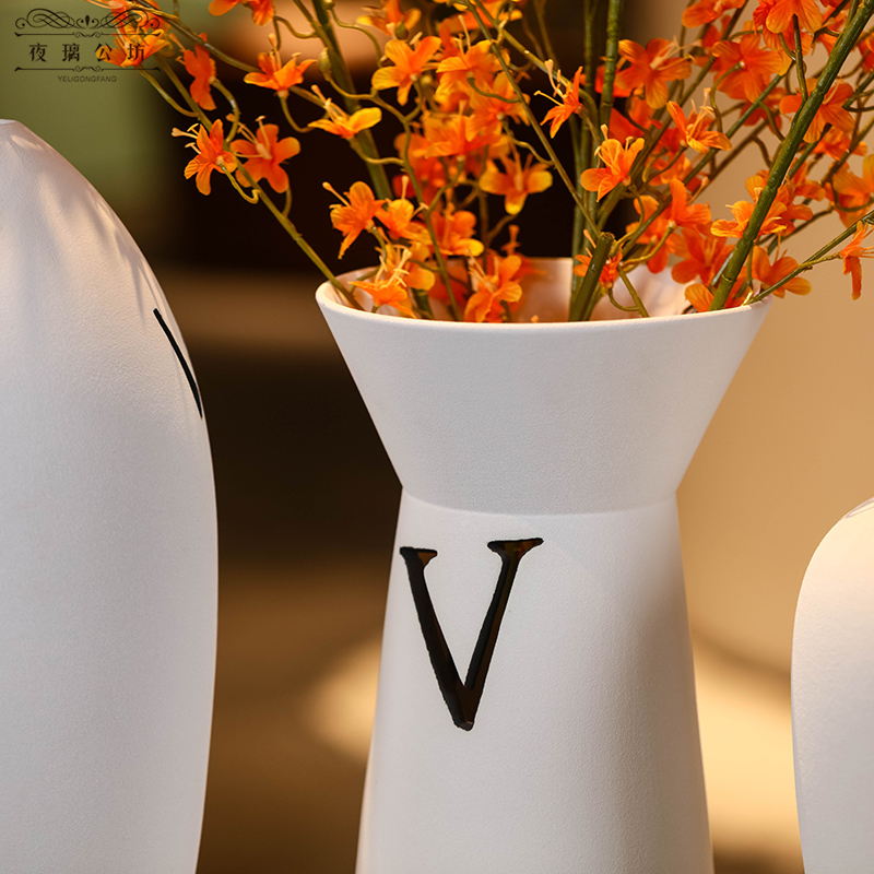 Nordic design is pure white ceramic vase medium contracted wind letter sitting room adornment is placed between example desktop