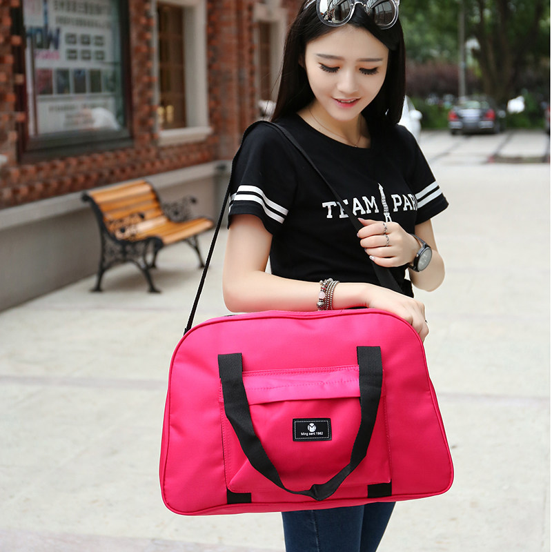 Korean version of the large-capacity folding travel bag female portable travel bag luggage bag short-distance travel bag sports fitness bag male