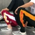 Phiên bản Hàn Quốc của mùa xuân mới phong cách Harajuku nam và nữ chân chùm quần harem màu sắc phù hợp với ngọn lửa in quần lỏng lẻo thủy triều