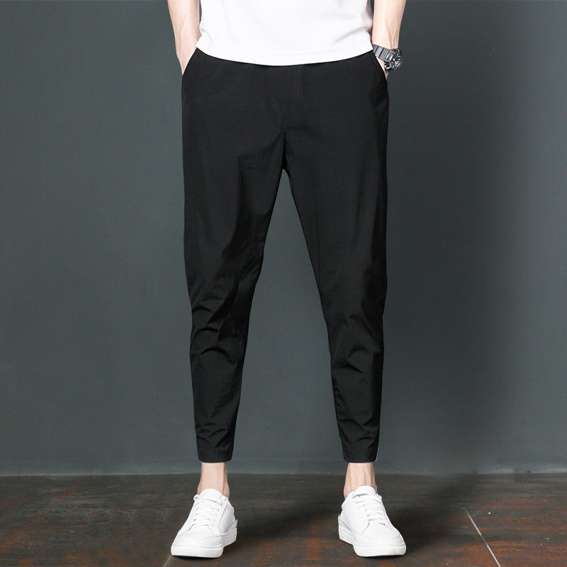 Men's nine-point pants Summer thin section Harun slim small feet Korean version of the trend beam feet Ruffian handsome ice silk casual pants