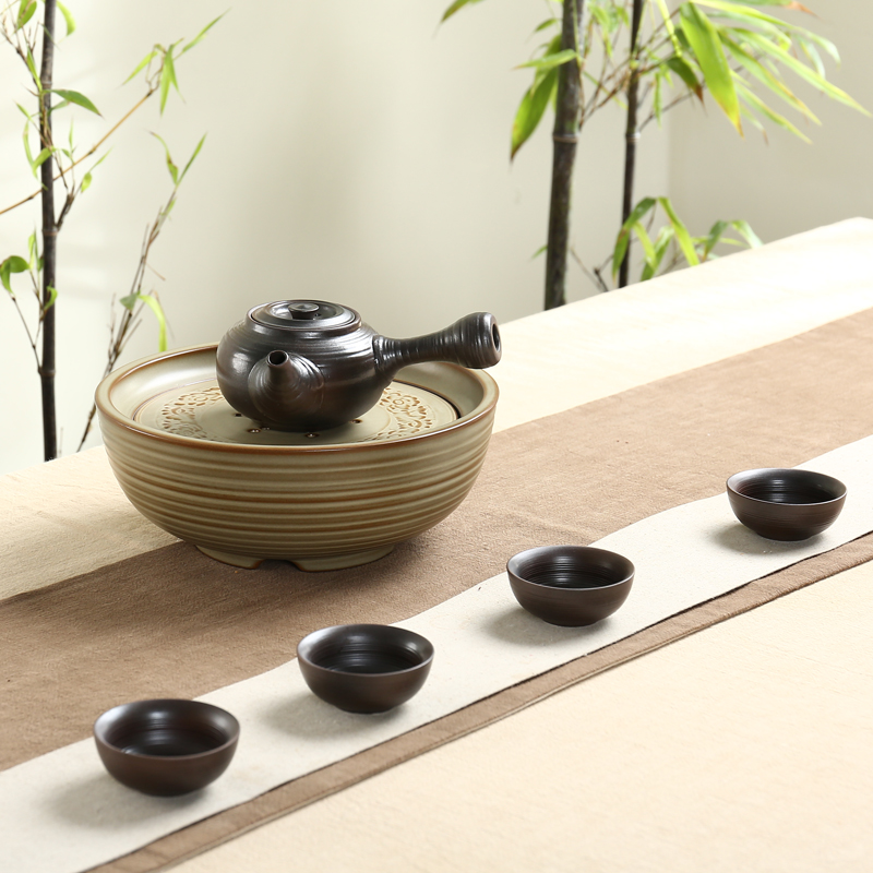 Ning uncommon dry tea with a pot of four cups of tea set side put the pot of ceramic tea tray was kung fu tea set