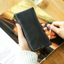 Xiaoxing has rice handmade leather wallet woman long zipper simple leather clamp retro head coat handle handheld mobile bag