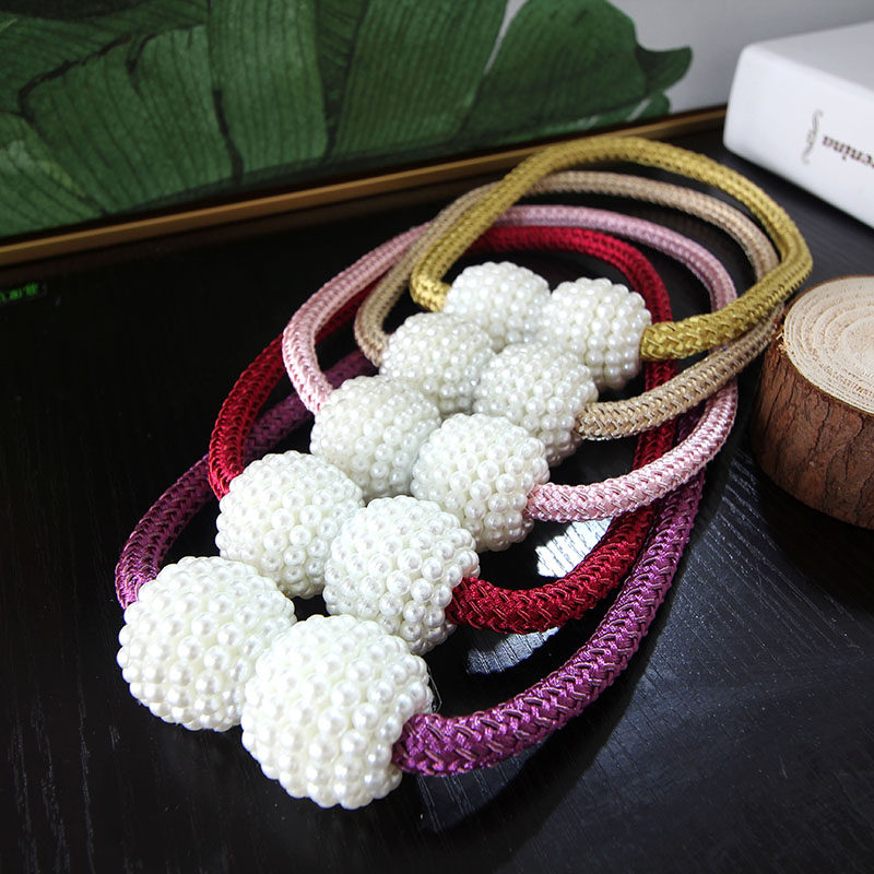 A pair of curtain buckle curtain cord strap tie