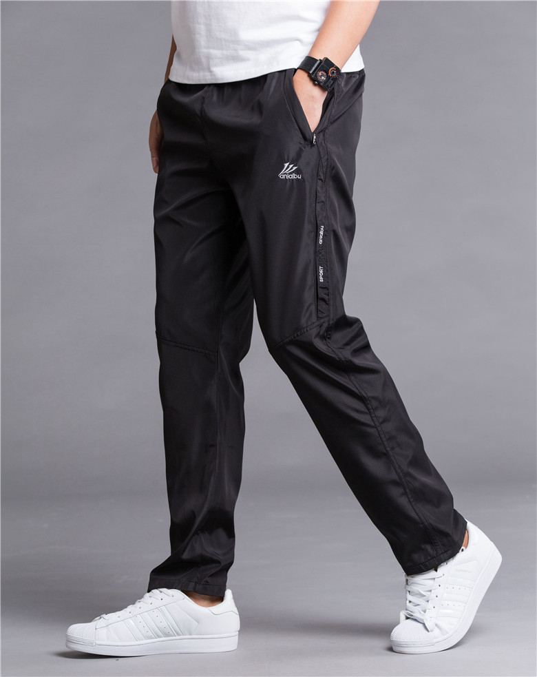 Mùa đông cộng với quần nhung dày thường xuyên quần tây nam quần polyester thoáng khí nhanh khô quần chống gió mùa xuân và mùa thu quần lỏng shop quần áo nam