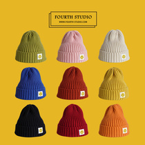 Spring knit hat wool hat female Japanese students cute cold hat thickened couple ear protection cone top warm hat tide