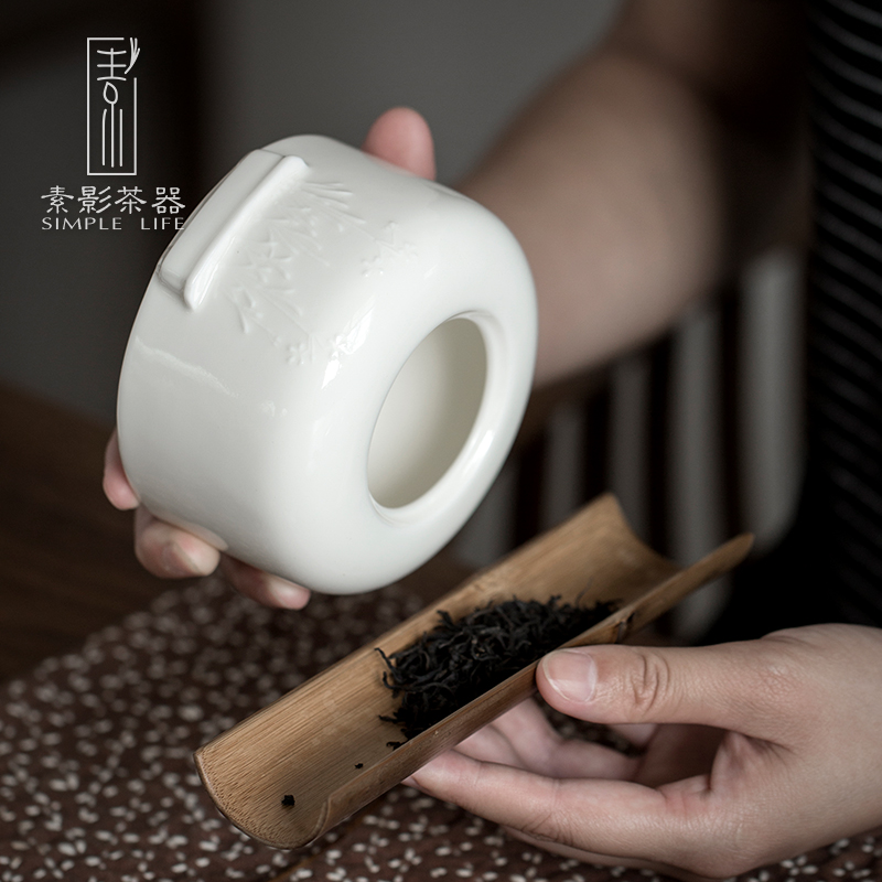 Plain film dehua white porcelain tea pot suet jade porcelain anaglyph ebony cover household ceramic tea storehouse wake tea boxes