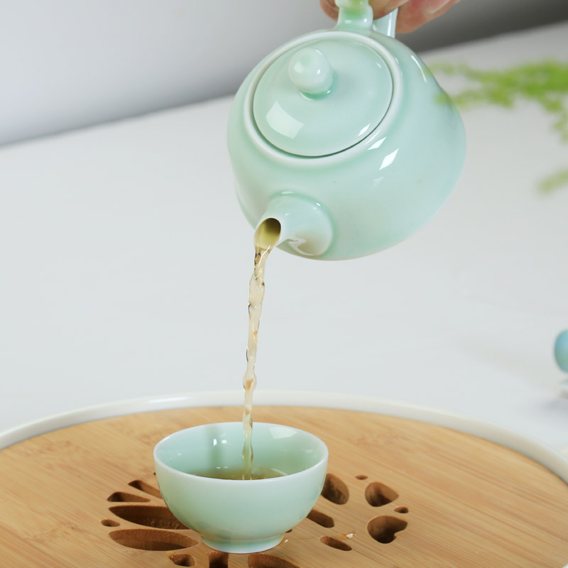 Is young, and a complete set of longquan celadon ceramic kung fu tea tea set teapot carp tea cup with tea