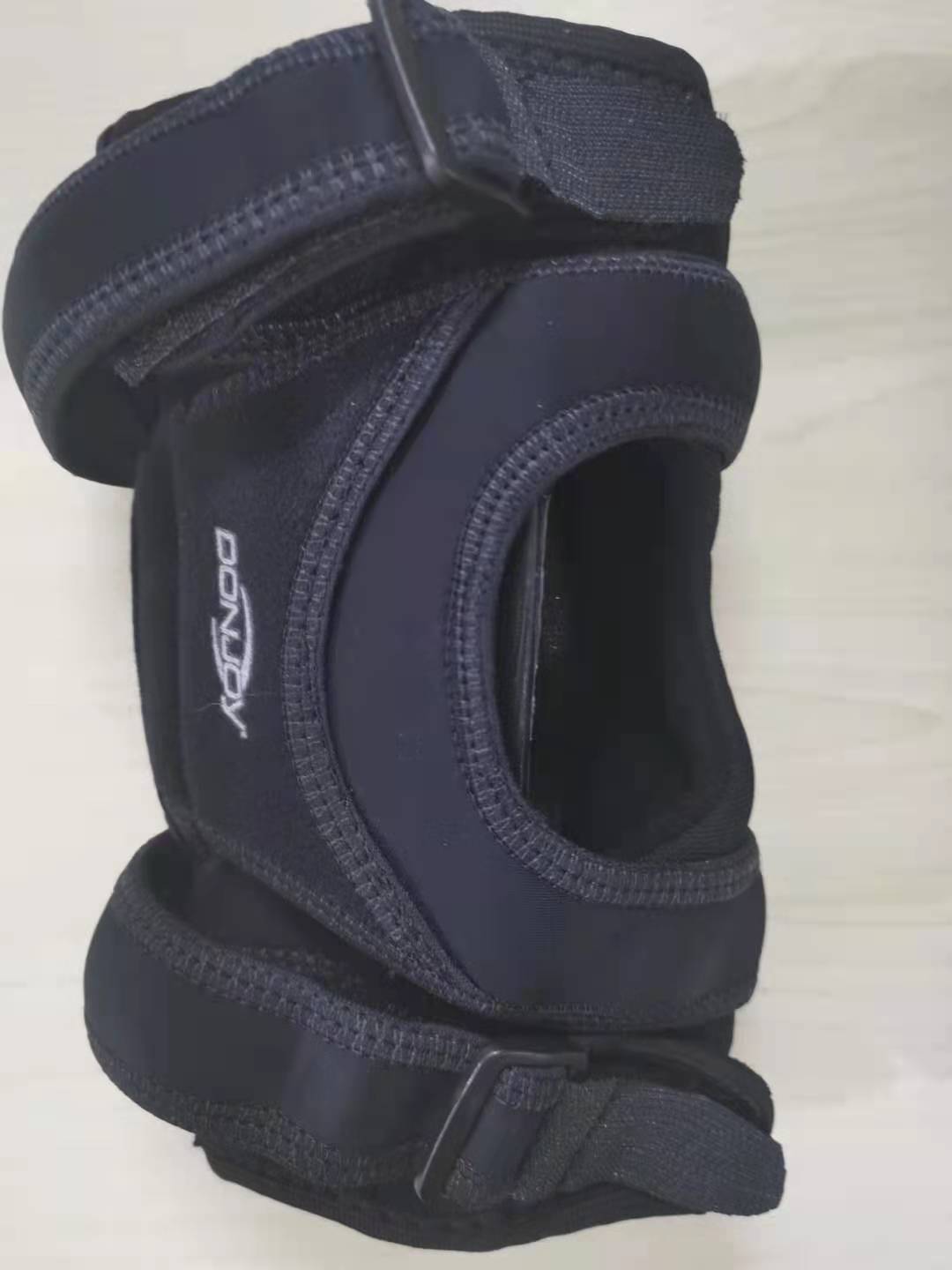 United States DJO patella fixed support patella depositions semi-dislocation patella stable kneecap protector