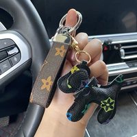 Серебряная печатная кожаная веревка+черный щенок