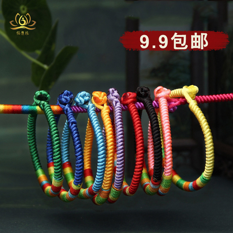 Colorful and colorful handmade rainbow hand of the five colorful handmade rainbow tie between the five colorful and willing red ropes.