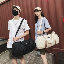 Tide brand Travel Bag Mens portable short-distance gym sports bag female Japanese and Korean student luggage bag light live School solid color