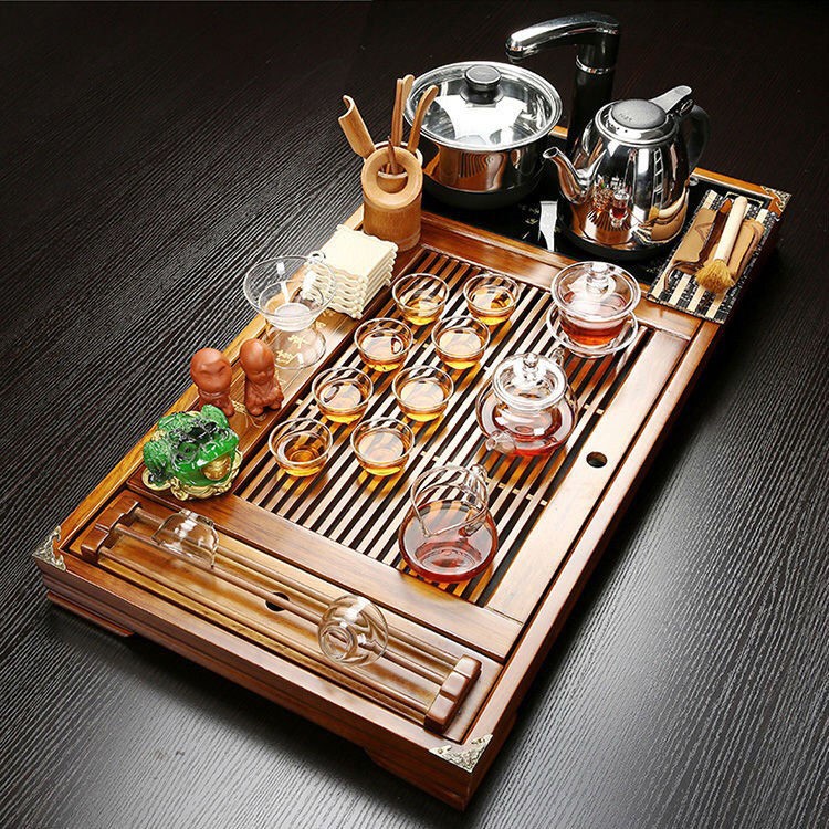 The hutch of a complete set of solid wood tea tray package ceramic kung fu tea tea set household contracted with integrated electric magnetic mixture furnace