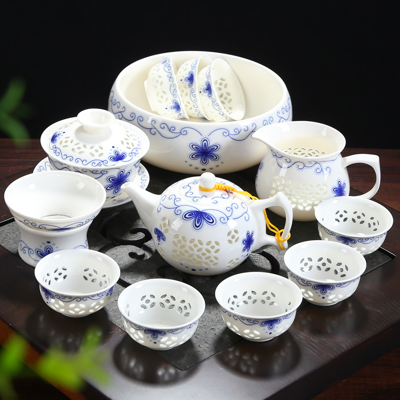 Qin Yi blue and white porcelain exquisite tea set set honeycomb hollow complete set of ceramic kung fu tea set teapot teacup cover bowl