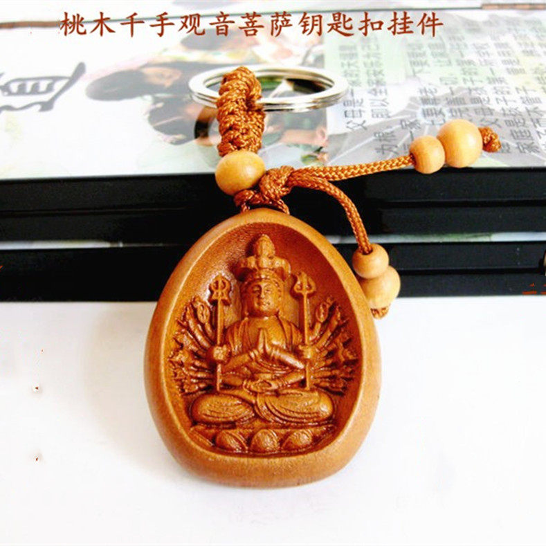 Peach wood engraving Thousand hands Guanyin Bodhisattva key buckle car pendant raw shooter's safe and auspicious gift hanging decoration