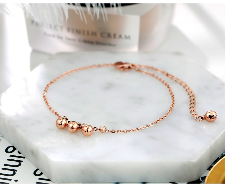 Hồi tưởng vòng chân của phụ nữ mạ 18 K rose gold titanium steel chuông trang trí chân màu vàng tua hạt màu đỏ Hàn Quốc phiên bản của sinh viên đơn giản vòng đeo chân nữ