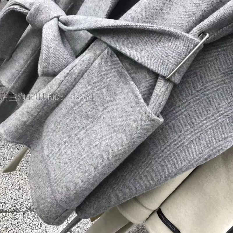 Phiên bản Hàn Quốc mới của áo len cashmere hai mặt khâu tay áo ngắn phần eo eo cá trích họa tiết vạt áo rộng vai măng tô nữ