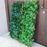 Украшение детского сада может растянуть забор садового забора для барбекю с листьями с листьями с выдвижным семейным забором.