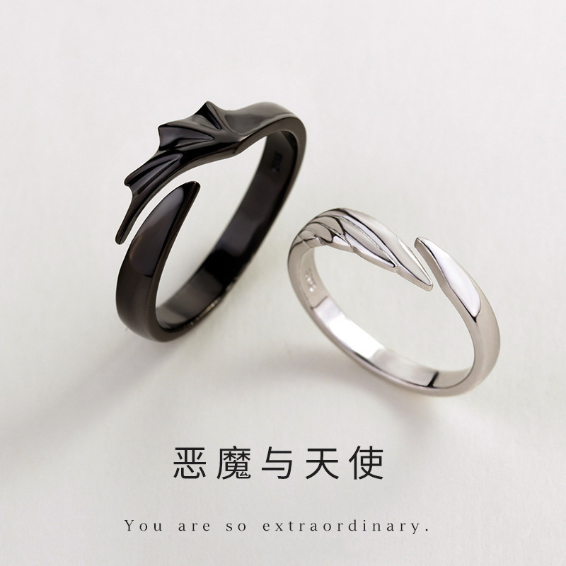 Devil and Angel Couple Ring refers to men and women with a pair of opening fingers ring fashionable black and white wings against ring
