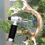 Bonsai шелковые резьбы по карнизированным распылителям, бонсай, размахивая головой и размалывает старый производственный инструмент ветропроницаемым пистолетом, чтобы починить огонь