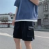 Quần short nam 2020 mới hè lỏng lẻo quần thể thao 5 điểm thương hiệu quần yếm thông thường áo liền quần phiên bản Hàn Quốc của thủy triều hoang dã - Quần làm việc Quần làm việc