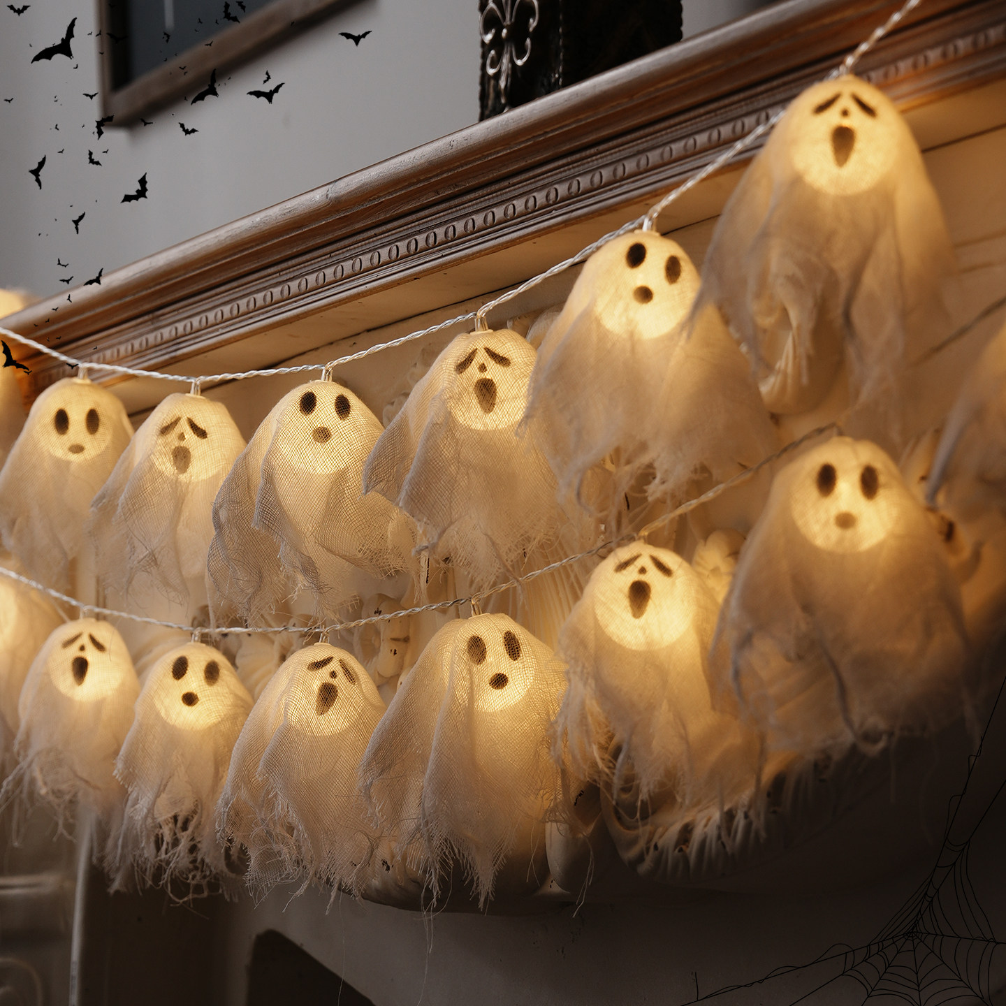 Halloween decorations, pumpkin ghost lights, string decorations, props, bar and shop ornaments, and atmosphere setup.