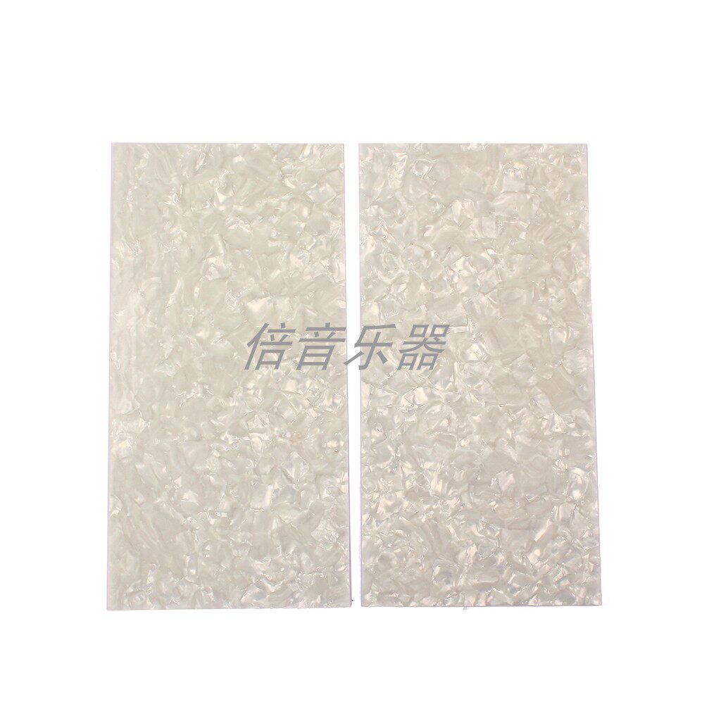 A set of two white pearl makeup boards