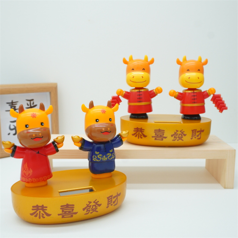 Cross-Border Firecracker Cow Solar Automatic Swing Doll Car Moving Head Decoration Creative Car Car Ornaments