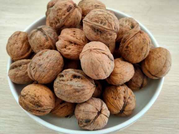 Xinjiang straight hair paper leather walnut 185 varieties hand peeled open new walnut without washing water without smoked roasted fruit kernel full