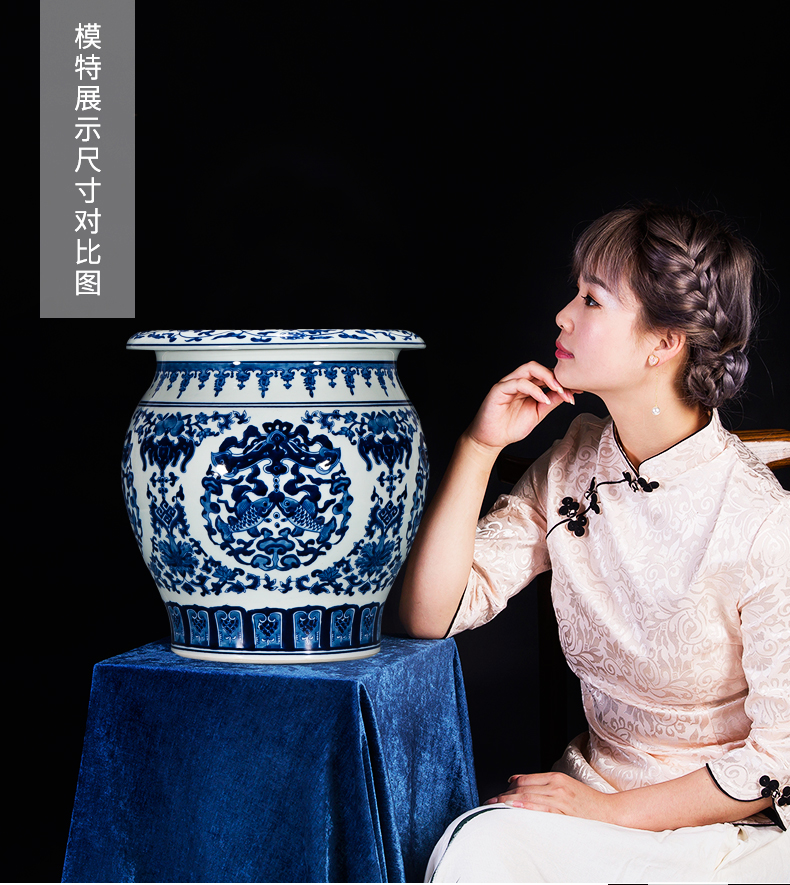 Jingdezhen ceramics by hand draw Chinese blue and white porcelain vase sitting room adornment is placed on the calligraphy and painting scroll cylinder