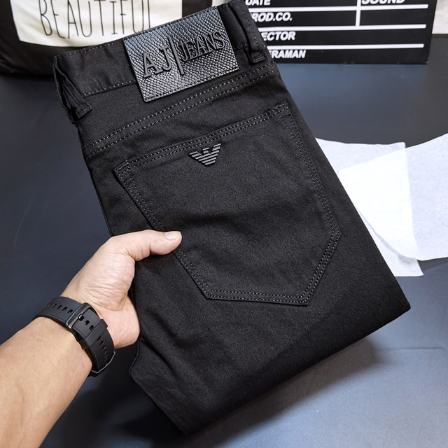 Spring and summer new pure black jeans for men, European and American simple, casual, versatile, slim, small feet, youth elastic pants