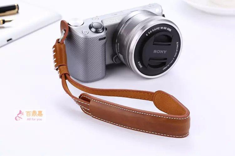 Suitable for Sony A6400A73 Canon M6 Fuji XT30 Oba EM10 micro single eye camera Anti-camera wrist leather bracelet