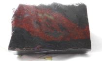 Guilin chicken blood jade exquisite natural jade mouth material black background and red brand wool material (IO43)