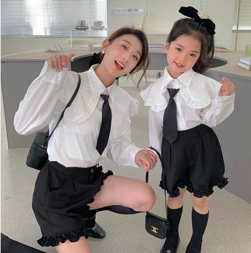 2022 Fall 2022 new parent - child clothing Han Edition Mother and woman load leaf tie - tape shirt suit to bring the girl Xiao Xiao Xiao