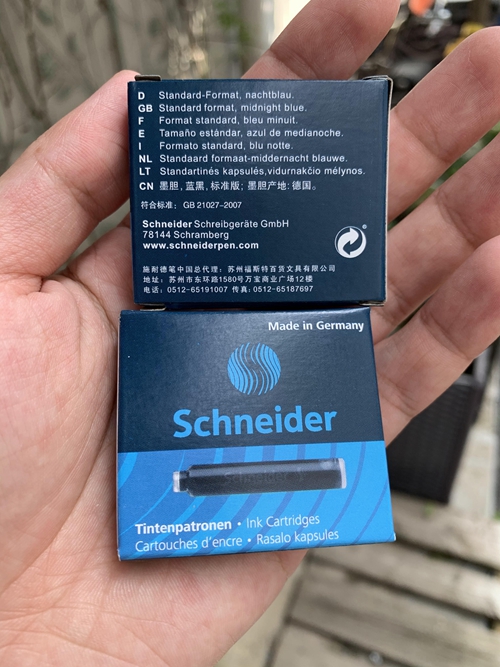 Imported ink sac pen supporting a box of 6