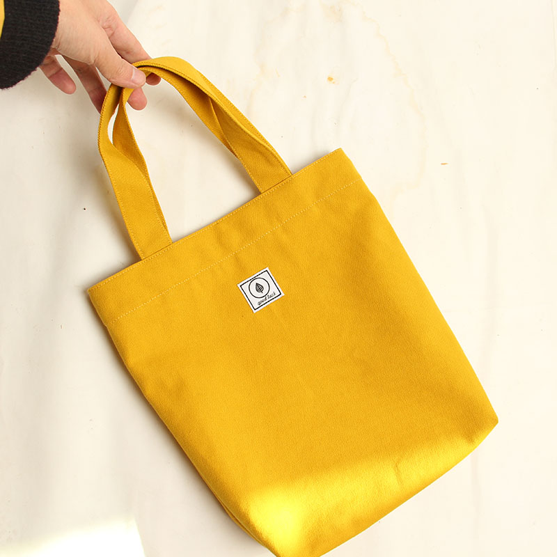 Brief PURE COLOR CANVAS HAND BAG SAILS CLOTH BAG STUDENT CLOTHING BOOK PORTABLE MEN AND WOMEN CARRY BOOK BAGS