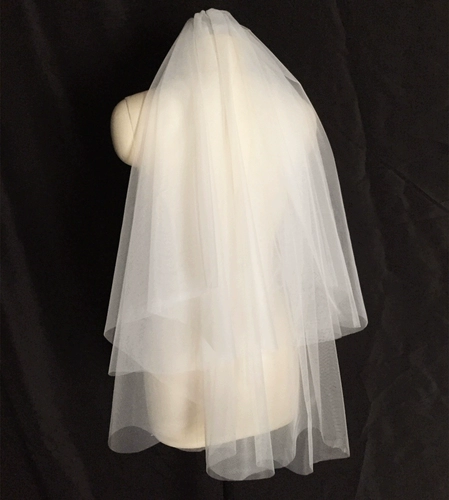 Сертификат свадебной невесты делает снимки двойной слой, покрытый самолетом.