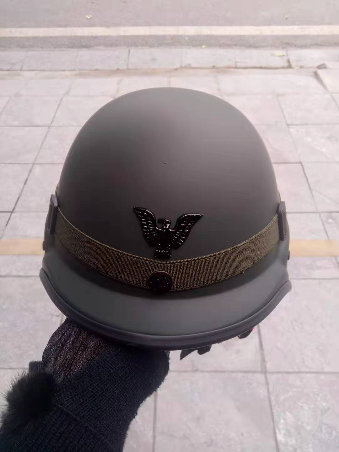 Vietnamese dark green protective layered motorcycle mountain bike wearing ear protection helmet cap