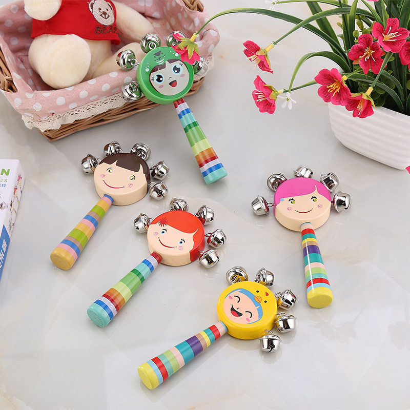 Hand holding cartoon hand bell baby early education newborn infants and young children 2-3-6-12 months 1 year old 9 educational toys