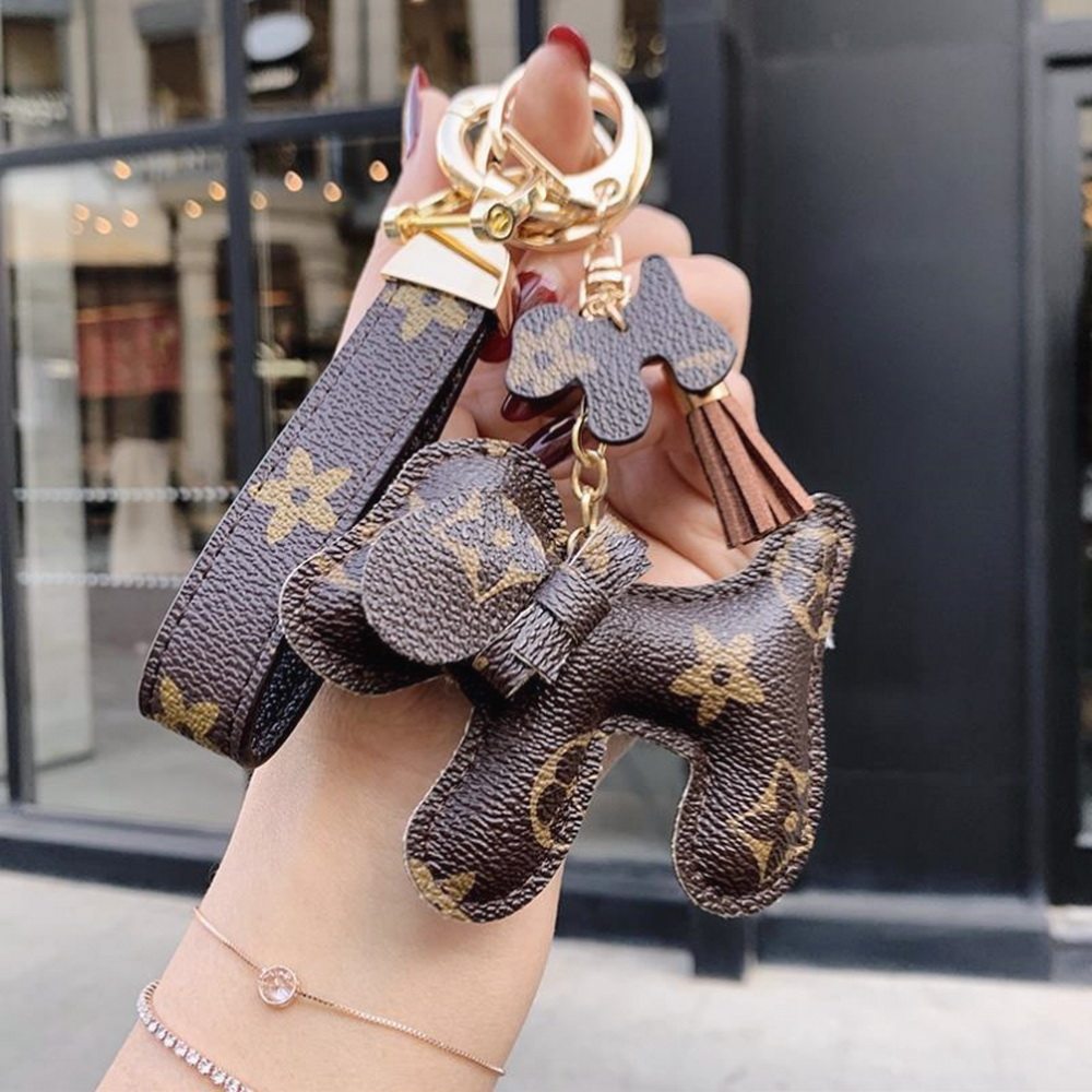 Suitable for LV ladies bag pendant new high-end leather doll bow dog keychain trinket trend