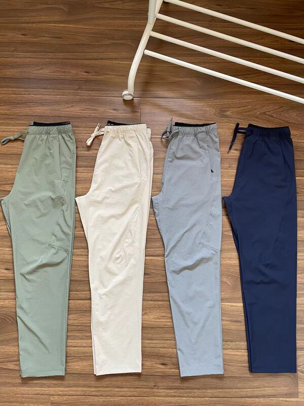 Men's Summer Outdoor Waterproof Lightweight Quick-Dry Breathable Long Pants with Simple Zipper Pockets and Straight-Leg Casual Design