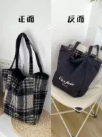 Круглая твидовая двусторонняя вертикальная клетка темно-серого цвета.