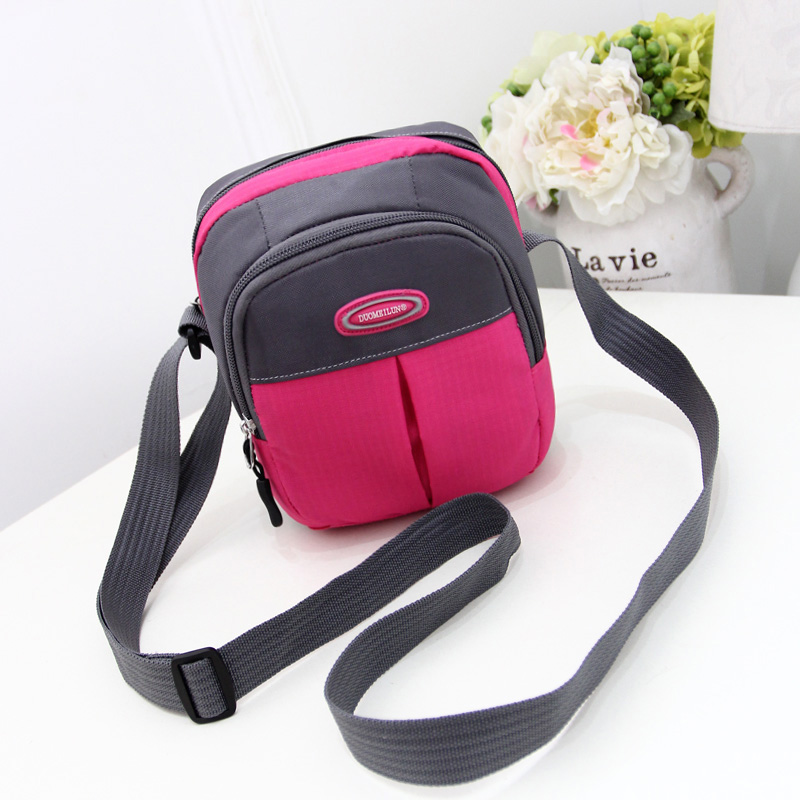 Korean version of the casual new horizontal and vertical style one-shoulder messenger women's bag mini Oxford travel mobile phone documents off couples small bag