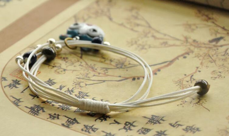 Handmade sáng tạo đồ trang sức nhỏ Jingdezhen gốm sứ dễ thương mèo vòng tay người yêu đồ trang sức unisex bện dây điều chỉnh vòng tay cao su