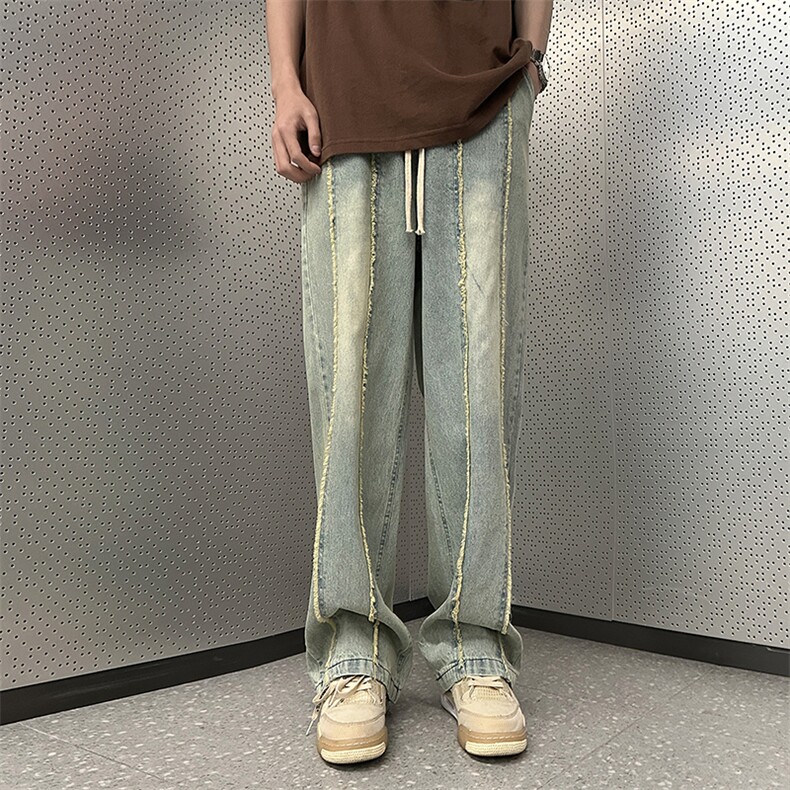 K64-P42美式宽松型毛边拼接牛仔长裤图片
