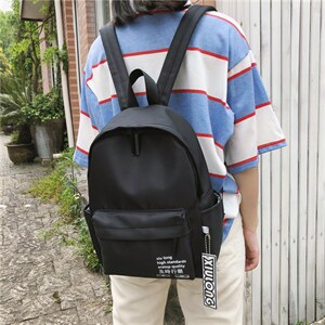 夏季新款时尚个性简约纯色少女双肩包尼龙防水书包图片