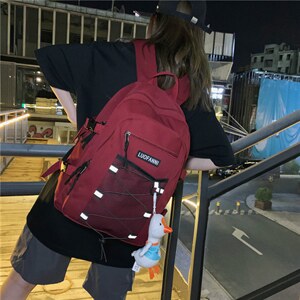 潮韩版校园旅行背包男个性交叉网大鹅挂件情侣双肩包图片