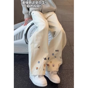 卡通刺绣弯刀牛仔裤男冬季潮牌痞帅裤子斜切微喇工装裤 NS662图片