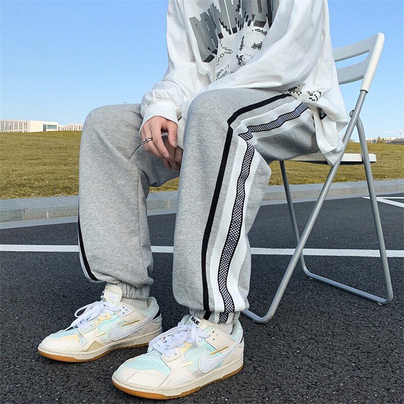 K3166-P45秋装潮流宽松中性男女情侣侧边棋盘格织带撞色休闲卫裤,男装休闲裤,电商A009A（原A058A）