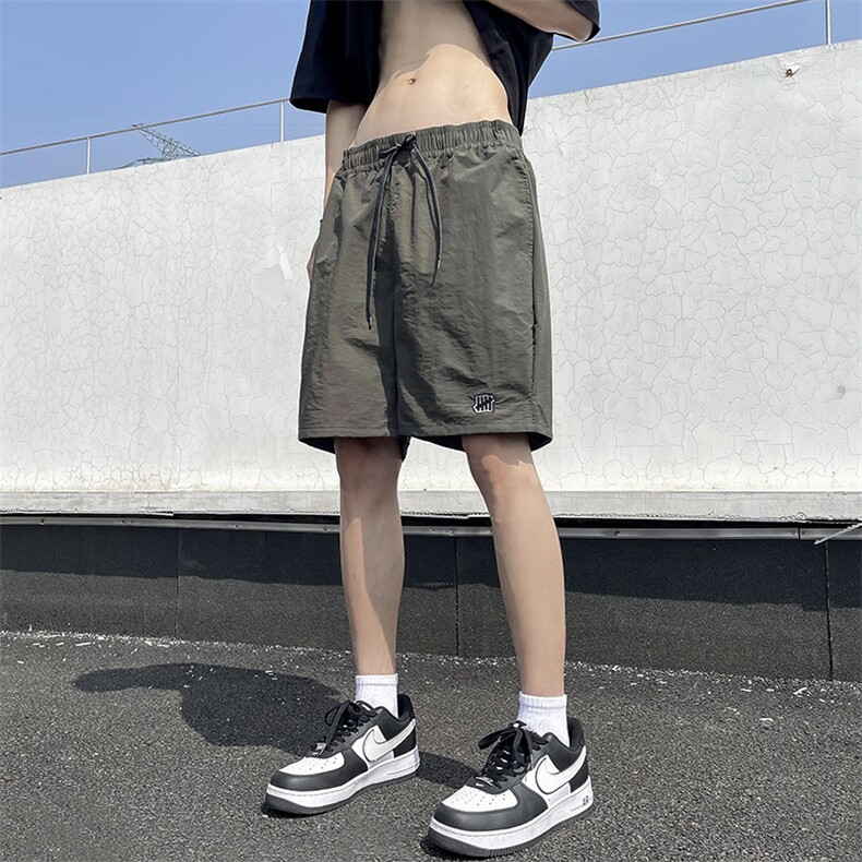 美式休闲户外运动速干短裤男士潮流百搭四分裤帅气沙滩裤网眼里布图片