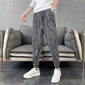 丝绒褶皱面料2025秋冬新款斑马纹休闲裤男韩版潮流小脚哈伦裤修身，男装休闲裤，电商A327